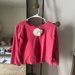 Out from under little pink cardigan with rose detail 🩷🌹